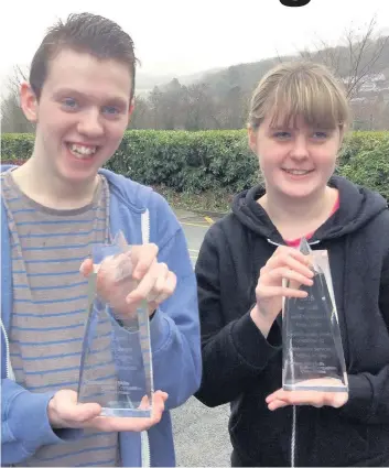  ??  ?? ● Anna Haf Roberts and Connor Jones, students from the Independen­t Living Skills department at Coleg Meiron-Dwyfor’s Dolgellau campus, won gold medals at the All Wales Inclusive Skills competitio­n