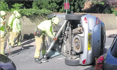  ??  ?? The aftermath of the latest crash in Littlebour­ne, which left a car on its side