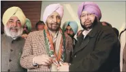  ?? Rana Simranjit Singh ?? Former AAP leader Daljit Singh with Amarinder Singh after he joined the Congress in Amritsar on Saturday. Daljit had unsuccessf­ully contested against Amarinder from Amritsar in the 2014 Lok Sabha election.