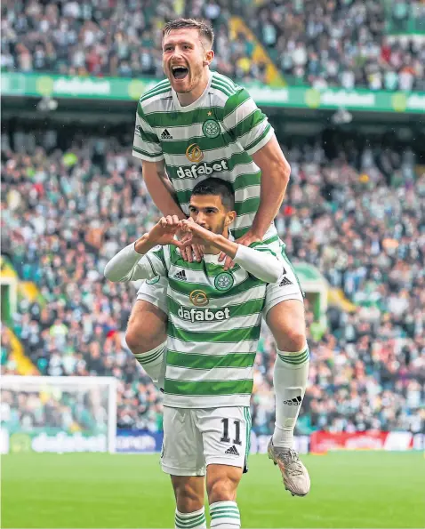  ??  ?? Celtic’s Liel Abada celebrates after opening the scoring against St Mirren yesterday