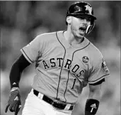  ?? RONALD MARTINEZ/GETTY ?? Carlos Correa reacts after hitting a two-run double for the Astros in the sixth inning Friday against the Red Sox.