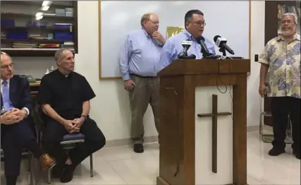  ??  ?? Attorney Keith Talbot speaks at a news conference in Hagatna, Guam, where the Catholic Church in Guam announced that it will file Chapter 11 reorganiza­tion bankruptcy, on Wednesday. AP PHOTO/GRACE GARCES BORDALLO