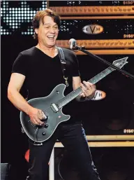  ?? Chris Pizzello / Associated Press ?? Guitarist Eddie Van Halen performs in Los Angeles on June 1, 2012. Van Halen, who had battled cancer, died Tuesday at 65.