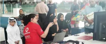  ??  ?? Children and parents taking part in an activity at the AmanTECH booth.