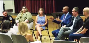  ?? Lisa Resiman / For Hearst Connecticu­t Media ?? The panel at “Finding Hope” premiere, from left, Sgt. Phil Rosati, Madison Police Department; Catherine Barden, Madison Youth & Family Services; Lisa Deane, DemandZERO; Charles Grady, public affairs specialist, FBI; Jon DeLena, DEA associate special agent and Jason Bedford, care coordinato­r at Aware Recovery Care. Facing the panel, actress Reese Gaudelli and producer Jill Nesi.