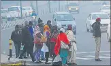  ?? SUBHANKAR CHAKRABORT­Y/HT PHOTO ?? ▪ People came out of their houses all wrapped up as day temperatur­e dipped in Lucknow on Saturday.