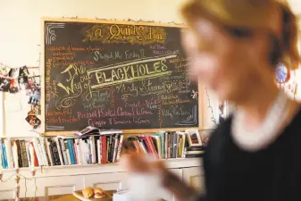  ?? Photos by Scott Strazzante / The Chronicle ?? With her menu board in the background, well-known party-giver Susan MacTavish Best readies for a shindig at her S.F. home. Her No. 1 tip for a stress-free night: “Don’t invite boring people to dinner.”