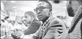  ?? AP NEWSFEATUR­ES ?? Black youths sit at the counter at the F.W. Woolworth store in Greensboro, N.C., in February 1960. They waited in vain for food service.