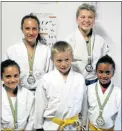  ??  ?? STARS: Five judokas from Queenstown attended the SA Schools Championsh­ip in Johannesbu­rg and returned with three gold medals and one silver with, back from left, Balmoral pupils Anje Strydom and Elske du Toit and front from left, Mieke Strydom of...