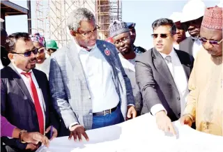  ??  ?? From left: Mr. Partha Ghosh; Minister of
Mines and Steel Developmen­t,
Arc. Olamilekan Adegbite; Chief of Staff to Kaduna State Government, Mohammed Sani; Managing Director, African Industries Group Company, Mr. Alok Gupta and others, during the minister’s tour of a $600m steel plant in Kagarko, Kaduna yesterday