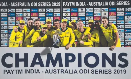  ??  ?? CHANGES OVER; Australian’s ODI squad cricketers celebrate after beating India in the final match of its five-game ODI series.