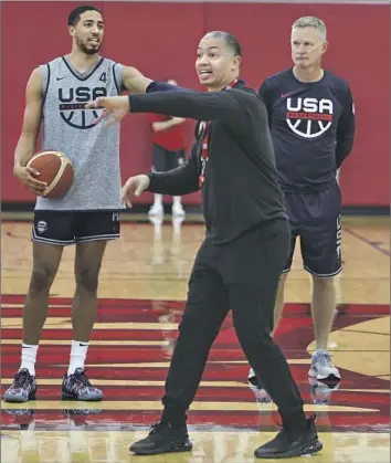  ?? Jim Poorten NBAE via Getty Images ?? CLIPPERS COACH Tyronn Lue, an assistant on Team USA, directs players during a practice at the University of Nevada Las Vegas last week as guard Tyrese Haliburton and head coach Steve Kerr look on.