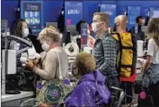  ?? Allen J. Schaben Los Angeles Times ?? EXPECT DELAYS and try to remain calm, experts advise. Above, travelers in an LAX terminal in May.