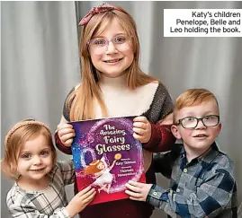  ?? ?? Katy’s children Penelope, Belle and Leo holding the book.