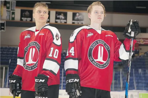  ?? — CHRIS RELKE/VANCOUVER GIANTS ?? Vancouver Giants centre Brad Morrison, left, and defenceman Bowen Byram model the Vimy Ridge centennial uniforms the team will wear for Friday night’s game against the Kamloops Blazers. The jerseys will be auctioned after the game.