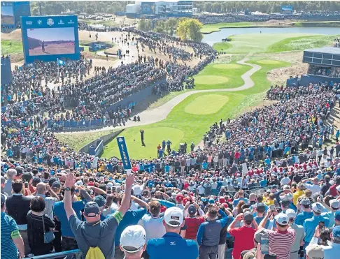  ??  ?? RING-FENCED? Huge galleries watch Tiger Woods tee off at the 2018 Ryder Cup at Le Golf National, Paris.