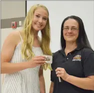  ?? TIMES photograph­s by Annette Beard ?? Blakelee Winn was presented a gift certificat­e to Raising Canes and an award by Jo Losey, shift manager of the Raising Cane’s, Rogers, restaurant.