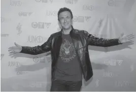  ?? CP FILE PHOTO ?? Colin James poses for photograph­s on the red carpet during the 2013 Juno Awards in Regina. James and Barney Bentall will play CN Centre on March 23.