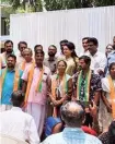  ?? ?? Youth Congress workers who joined the BJP are given reception at Murali Mandiram in Thrissur on Tuesday.