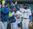  ?? SETH WENIG — THE ASSOCIATED PRESS ?? New York Mets’ Yoenis Cespedes, left, and Amed Rosario celebrate after the baseball game against the Philadelph­ia Phillies at Citi Field, Wednesday in New York. The Mets defeated the Phillies 4-2.