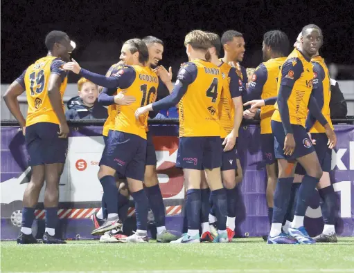  ?? ?? Slough Town players celebrate their victory against Hemel Hempstead Town. Photo: George Beck