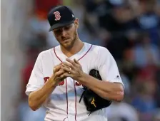  ?? STUART CAHILL / BOSTON HERALD ?? FEELING BLUE: Chris Sale reacts after giving up a home run to the Dodgers’ Justin Turner during the Red Sox’ 11-2 loss last night at Fenway.