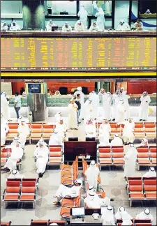  ?? Photo by Anwar Daifallah ?? Photo shows market participan­ts at KSE trading floor. The bourse saw modest
gains on Wednesday.