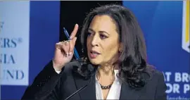  ?? Photograph­s by Mark J. Terrill Associated Press ?? AS THE state’s top enforcemen­t official, Kamala Harris has a high profile, which she uses to make a case to voters about her record and qualificat­ions.