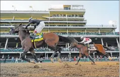  ?? Jeff Roberson The Associated Press ?? Authentic, left, crosses the finish line ahead of Tiz the Law to win the Kentucky Derby. The loss cost Tiz the Law a shot at the Triple Crown and he can get his revenge at the Belmont Stakes, where the two could meet again.