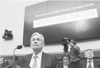  ?? Olivier Douliery / Abaca Press / TNS ?? Federal Reserve Chairman Jerome Powell testifies before the House Financial Services Committee during a hearing that lasted more than three hours.