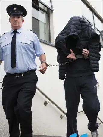  ??  ?? Michael Cash is led from Bray courthouse following his sentencing yesterday (Tuesday).