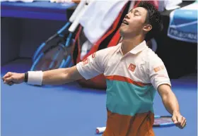  ?? Greg Wood / AFP / Getty Images ?? Kei Nishikori celebrates his five-set victory against Ivo Karlovic in the Australian Open. Nishikori won the first two sets but dropped the 11th games of the third and fourth sets, and then had to save three break points in a crucial 10th game of the fifth set to win.