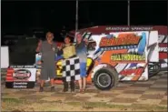  ?? SUBMITTED PHOTO - RICH KEPNER ?? Dylan Swinehart, center, celebrates in victory lane with grandfathe­rs Dennis Bailey and Ray Swinehart after his first career Sportsman win on August 13 at Grandview.