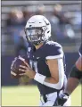  ?? Stephen Dunn / Associated Press ?? UConn quarterbac­k Jack Zergiotis looks to pass during the second half of the Huskies’ 2417 loss to Houston on Saturday in East Hartford.