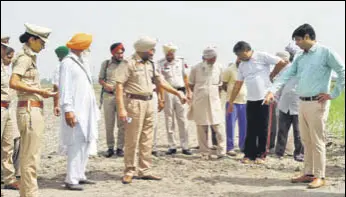  ?? HT PHOTO ?? Police at the spot where the girl was attacked by stray dogs in Sangrur on Thursday.