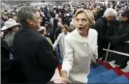  ?? THE ASSOCIATED PRESS ?? Hillary Clinton leaves after the presidenti­al inaugurati­on on Capitol Hill in Washington on Friday.