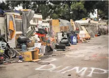  ?? Noah Berger / Special to The Chronicle ?? Recreation­al vehicles are seen parked on 37th Avenue behind Home Depot in Oakland’s Fruitvale neighborho­od.