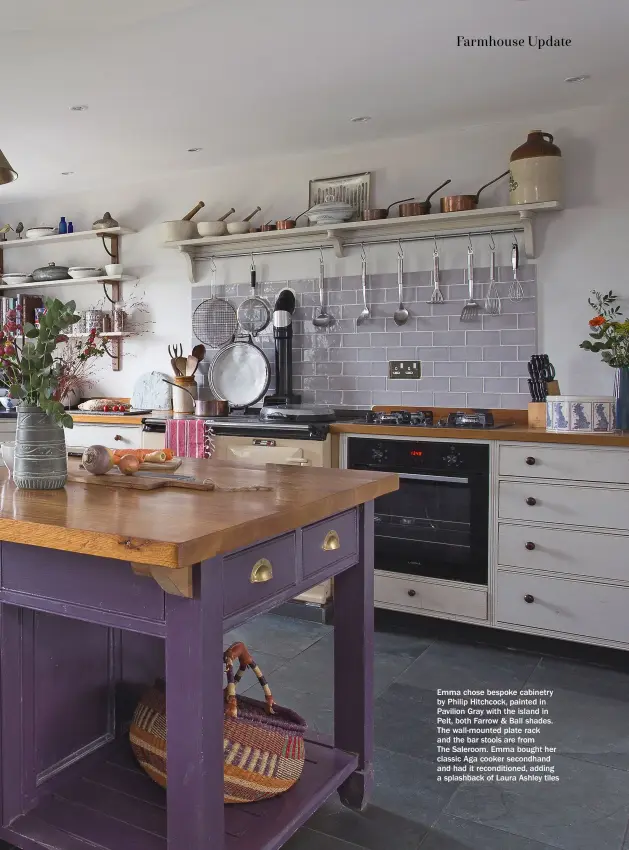  ??  ?? Emma chose bespoke cabinetry by Philip Hitchcock, painted in Pavilion Gray with the island in Pelt, both Farrow & Ball shades. The wall-mounted plate rack and the bar stools are from
The Saleroom. Emma bought her classic Aga cooker secondhand and had it reconditio­ned, adding a splashback of Laura Ashley tiles