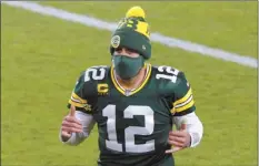  ?? AP photo ?? Packers quarterbac­k Aaron Rodgers reacts as he runs off the field after Green Bay’s win over Chicago on Sunday.