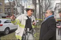  ?? Lori Van Buren / Times Union ?? Don Mareno, left, will become the city's next fire chief. Mareno is see here talking to the general manager of the Stockade Inn after a fire at the establishm­ent in 2020.