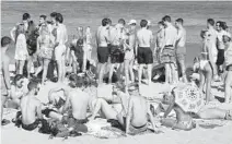  ?? MIKE STOCKER/SOUTH FLORIDA SUN SENTINEL ?? Pockets of the beach were crowded in Fort Lauderdale on March 4 as Spring Break started to ramp up at Fort Lauderdale beach and nearby bars.