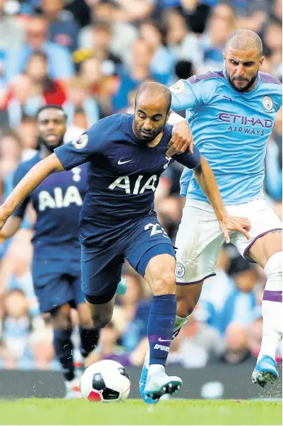  ?? AP ?? Tottenham’s Lucas Moura (left) duels for the ball with Manchester City’s Kyle Walker during the English Premier League match between Manchester City and Tottenham Hotspur at Etihad Stadium in Manchester, England, yesterday. The match ended 2-2.