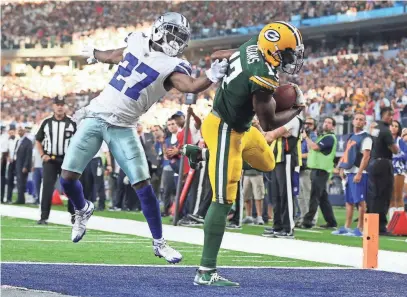  ?? MATTHEW EMMONS, USA TODAY SPORTS ?? Packers receiver Davante Adams scores the winning touchdown against the Cowboys with 11 seconds remaining.