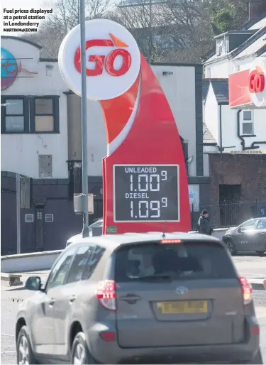  ?? MARTIN MCKEOWN ?? Fuel prices displayed at a petrol station in Londonderr­y