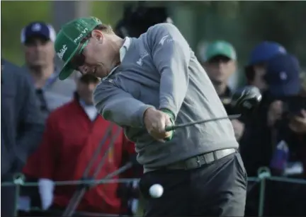  ?? CHRIS CARLSON — ASSOCIATED PRESS ?? Tournament leader Charley Hoffman hits a drive on 18th hole during opening-round of the Masters Thursday in Augusta, Ga.