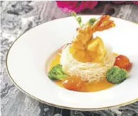  ?? ?? CRYSTAL Dragon’s Crispy Egg Noodle with King Tiger Prawn in Rich Aromatic Prawn Broth.