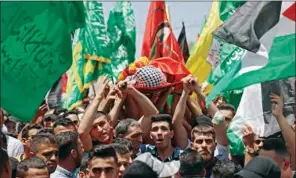  ?? (AFP) ?? Mourners attend the funeral of Palestinia­n Rashid Abu Ara, 16, who was killed during clashes with Israeli troops in village of Aqaba near Nablus, in the north of the occupied West Bank on Wednesday.