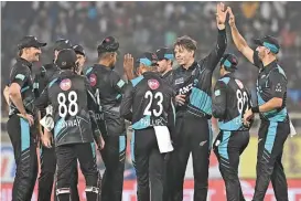  ?? (AFP) ?? New Zealand's players celebrate their win against India in their first T20 in Ranchi on Friday