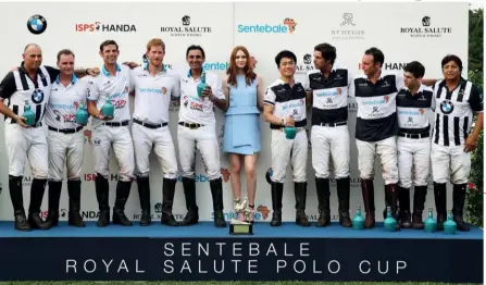  ??  ?? TEAM SPIRIT The Sentebale ISPS Handa team (pictured left, with Scottish actress Karen Gillan) clinched victory over the St Regis team, with the winning ball struck by Prince Harry in the final chukka