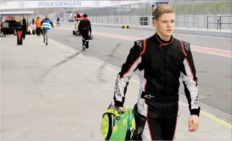  ?? [ EPA ] ?? Mick Schumacher und der lange Weg an die Spitze des Motorsport­s. Er hat als Sohn eines Rekordcham­pions doppelt schwer zu tragen.